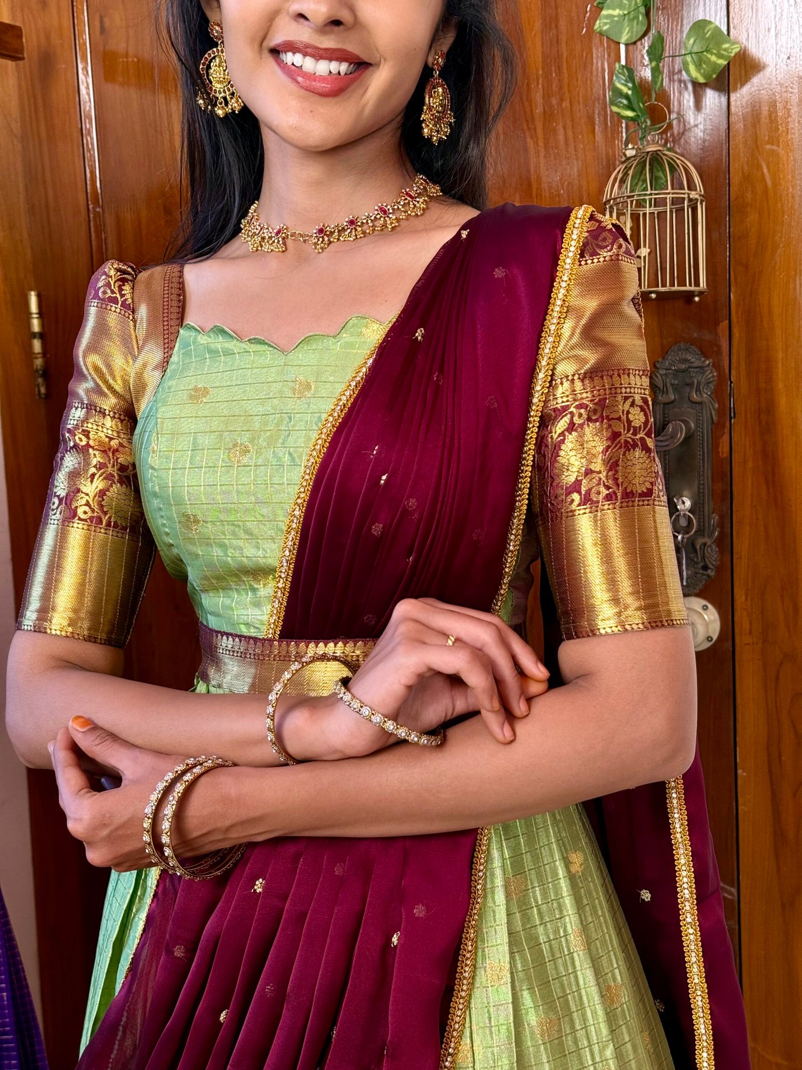 Kanmani Green and dark wine lehenga